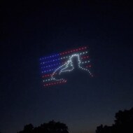 An image from an NLDS drone show featuring a saluting figure that appeared in the NLDS New Berlin 4th of July show. An image from an NLDS drone show featuring a saluting figure that appeared in the NLDS New Berlin 4th of July show.