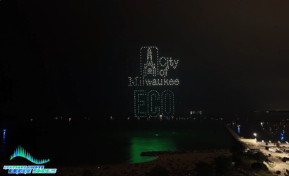 An image from an NLDS drone show featuring a custom City of Milwaukee sign above a festival crowd.