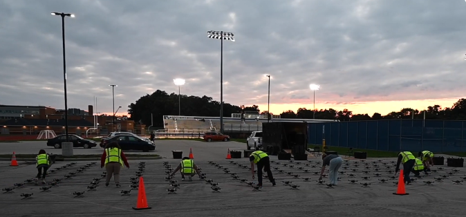 An image from an NLDS drone show depicting our ground crew setting up the drones in a safe area. An image from an NLDS drone show depicting our ground crew setting up the drones in a safe area.