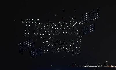 An image from an NLDS drone show depicting the words "Thank you!"
