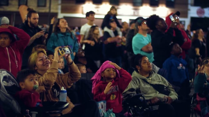 An image of spectators at an NLDS drone show enjoying themselves.
