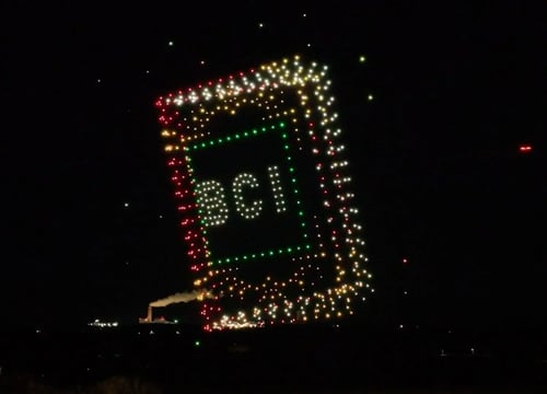 An image from the BCI Celebration show featuring a book opening.