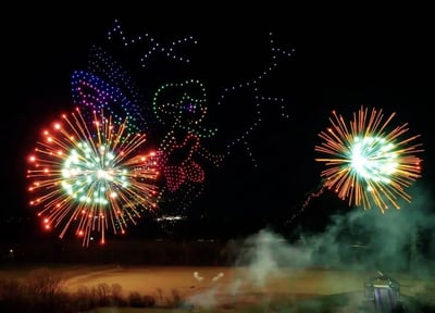 An image from the BCI Celebration show featuring a fairy coupled with fireworks.