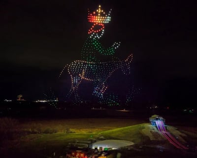 An image from the BCI Faith Celebration featuring Jesus Christ with a crown on a donkey.