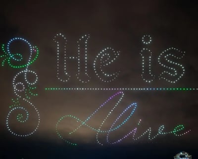An image from the BCI Faith Celebration featuring the words "He is Risen."