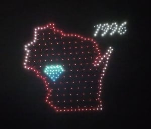 An image from the Ho-Chunk Gaming show featuring a map of Wisconsin as well as a diamond where the show took place.