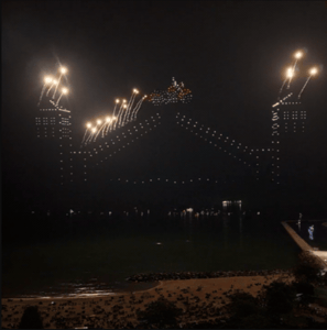 An image from a scene of a motorcycle jumping over a folding bridge during the Milwaukee 4th of July show. An image from a scene of a motorcycle jumping over a folding bridge during the Milwaukee 4th of July show.