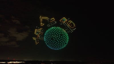 An image from the Timber Wolf 10-year Anniversary show featuring construction machines circling the globe.