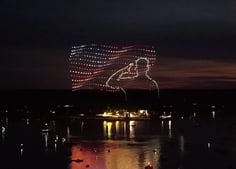 An image from an NLDS drone show featuring a saluting figure that appeared in the NLDS Windjammer Days show.