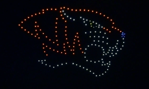 A drone show depicting a sports team's logo for a stadium audience.