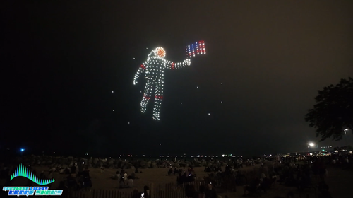 An image depicting an astronaut holding an American flag during a Northern Lights Drone Show.