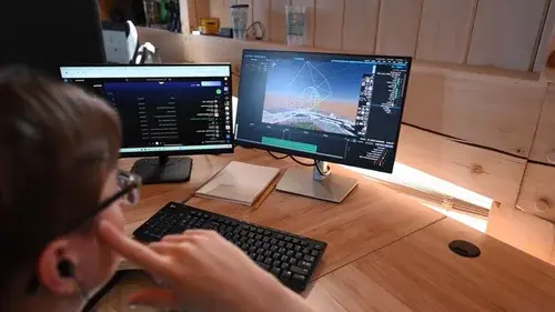 An image of an NLDS drone show designer working at their desk.