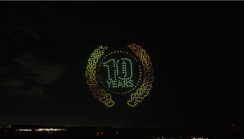An image from an NLDS drone show depicting a 10-year celebration symbol for a company's annual party. An image from an NLDS drone show depicting a 10-year celebration symbol for a company's annual party.