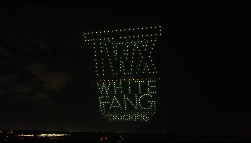An image from an NLDS drone show depicting a company's logo and tagline. An image from an NLDS drone show depicting a company's logo and tagline.