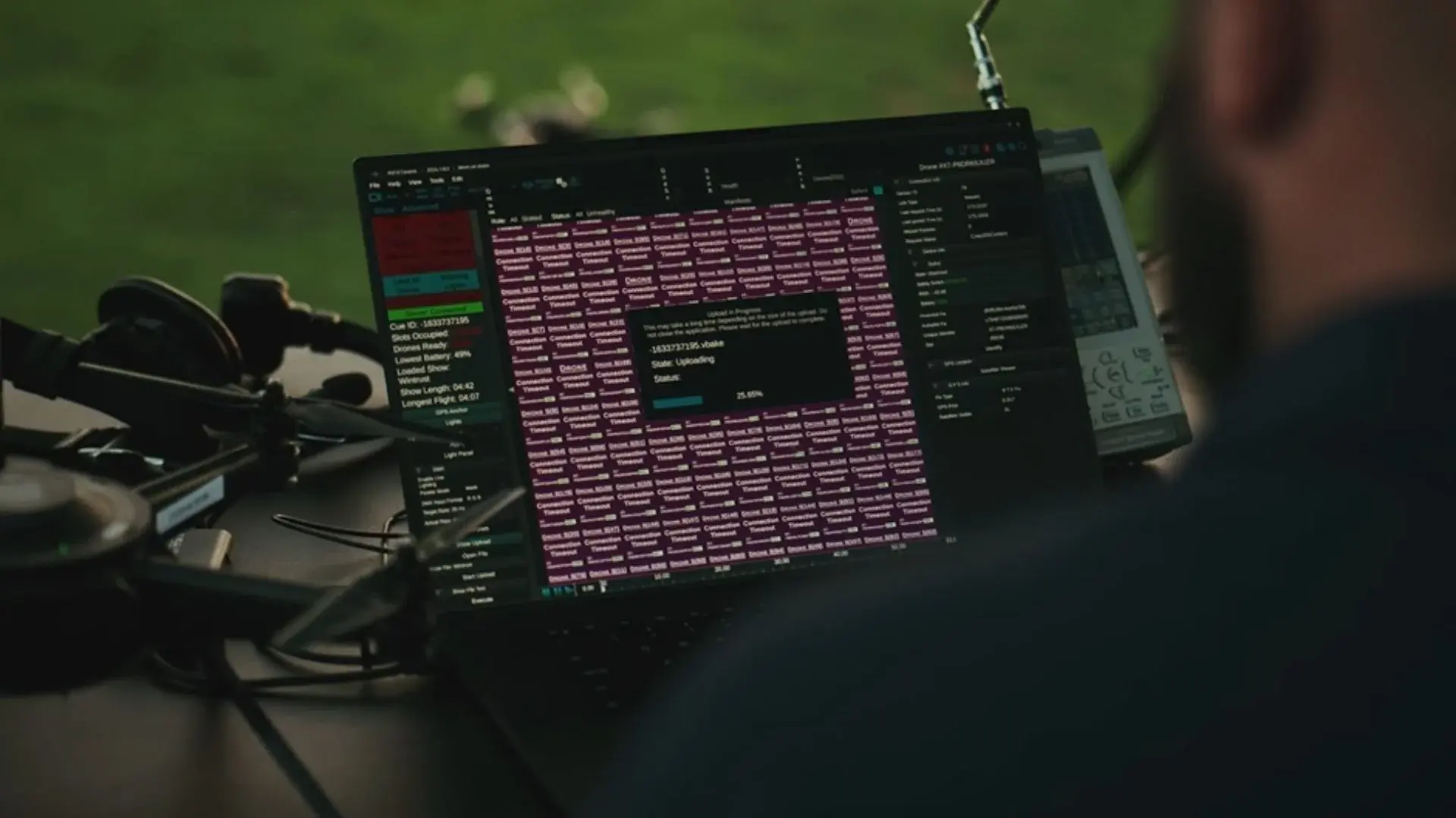 An image of an NLDS drone pilot examining his software prior to launch.