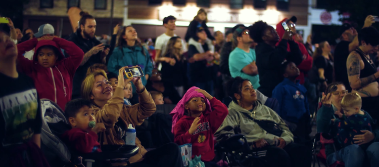 An image from an NLDS drone show depicting the spectators mesmerized by the show.