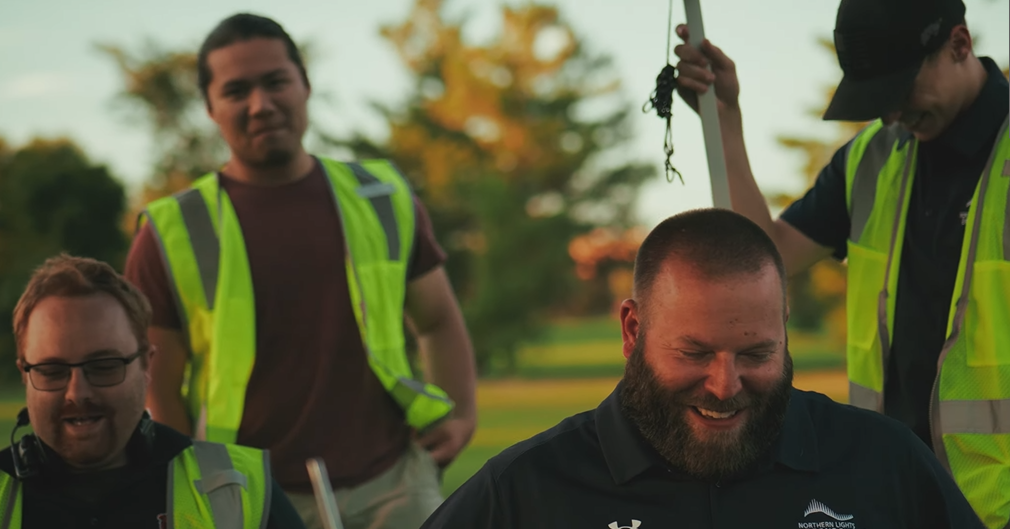 An image of the setup of an NLDS drone show, with our lead pilot having fun with the groundcrew members. An image of the setup of an NLDS drone show, with our lead pilot having fun with the groundcrew members.