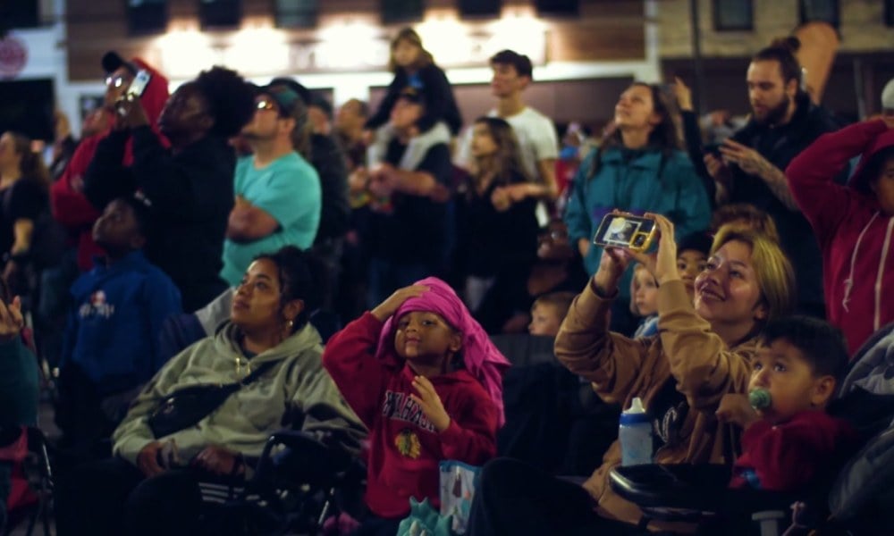 An image of spectators watching an NLDS drone show.