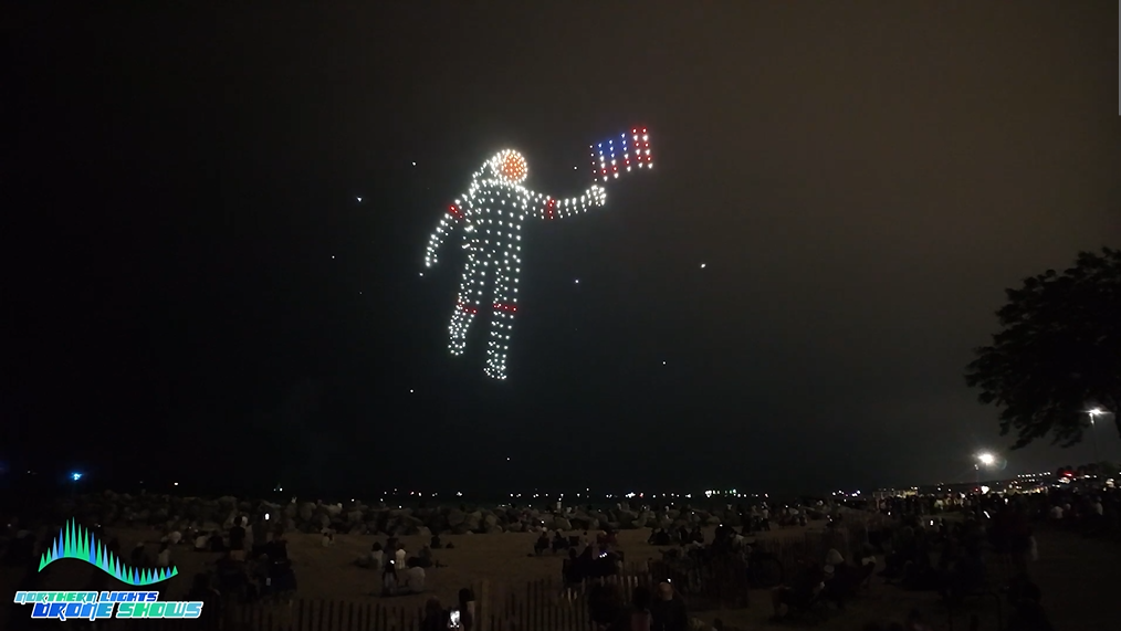An image from an NLDS drone show of that same astronaut but much bigger and more defined.