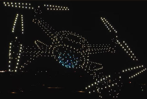An image from an NLDS drone show depicting the drones taking the shape of a drone. An image from an NLDS drone show depicting the drones taking the shape of a drone.