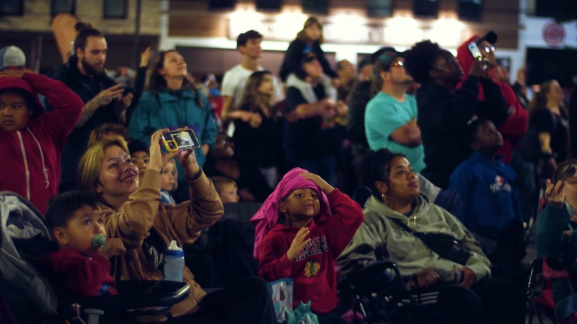 An image from an NLDS drone show depicting a crowd marveling at a drone show. An image from an NLDS drone show depicting a crowd marveling at a drone show.