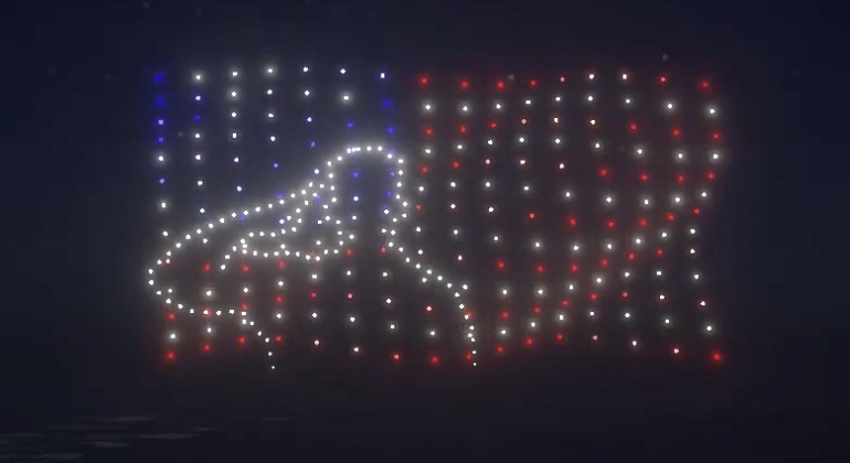 An image of a soldier saluting during the Lake Geneva NLDS drone show. An image of a soldier saluting during the Lake Geneva NLDS drone show.