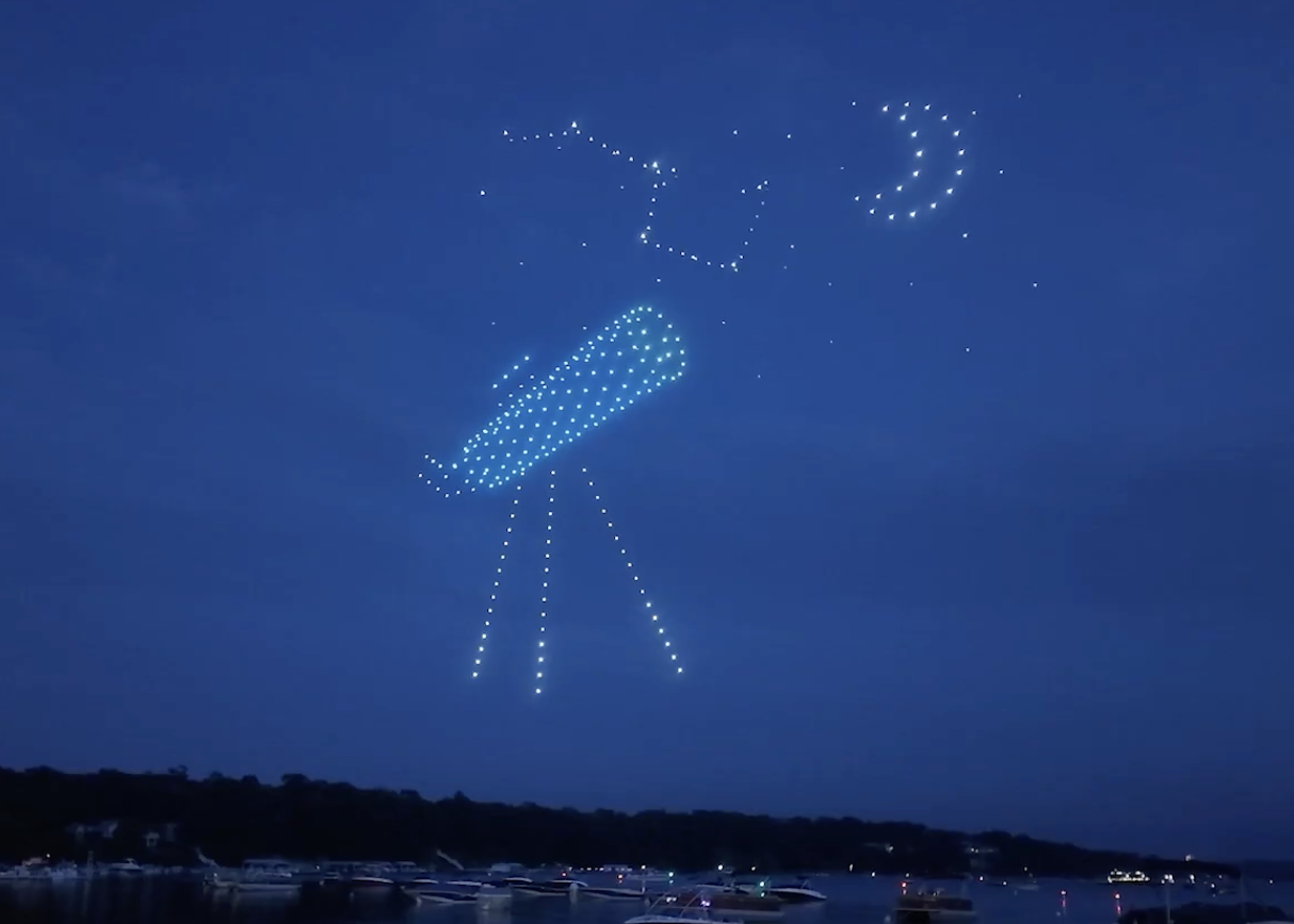 An image from the Lake Geneva NLDS drone show featuring a telescope. An image from the Lake Geneva NLDS drone show featuring a telescope.