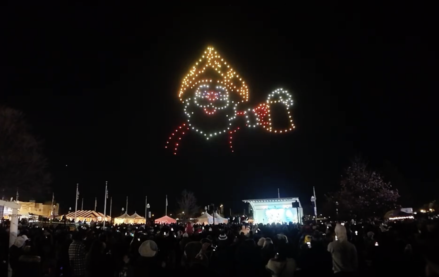 An image from the Kenosha Lightin' Up show featuring Santa with a cheesehead.