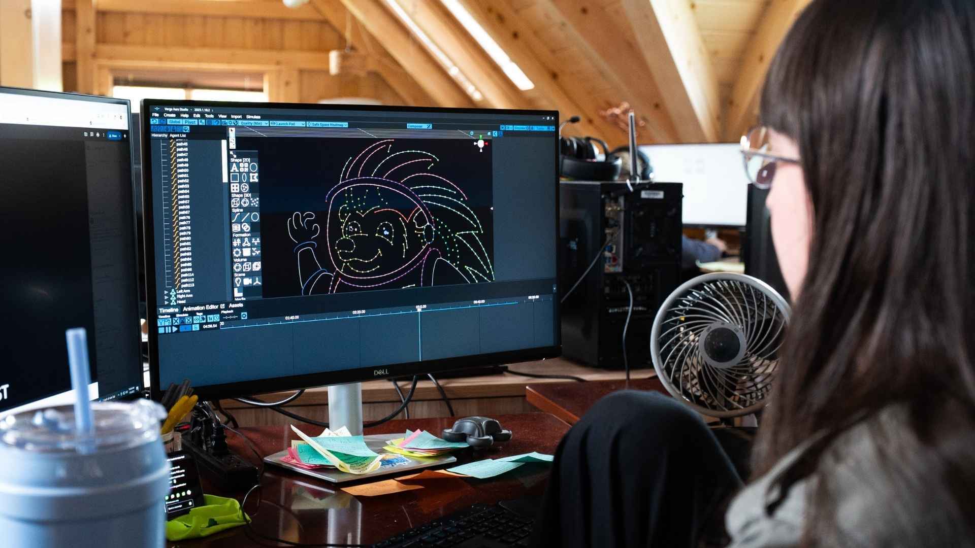 An image of an NLDS drone show designer overseeing the storyboard creation process.