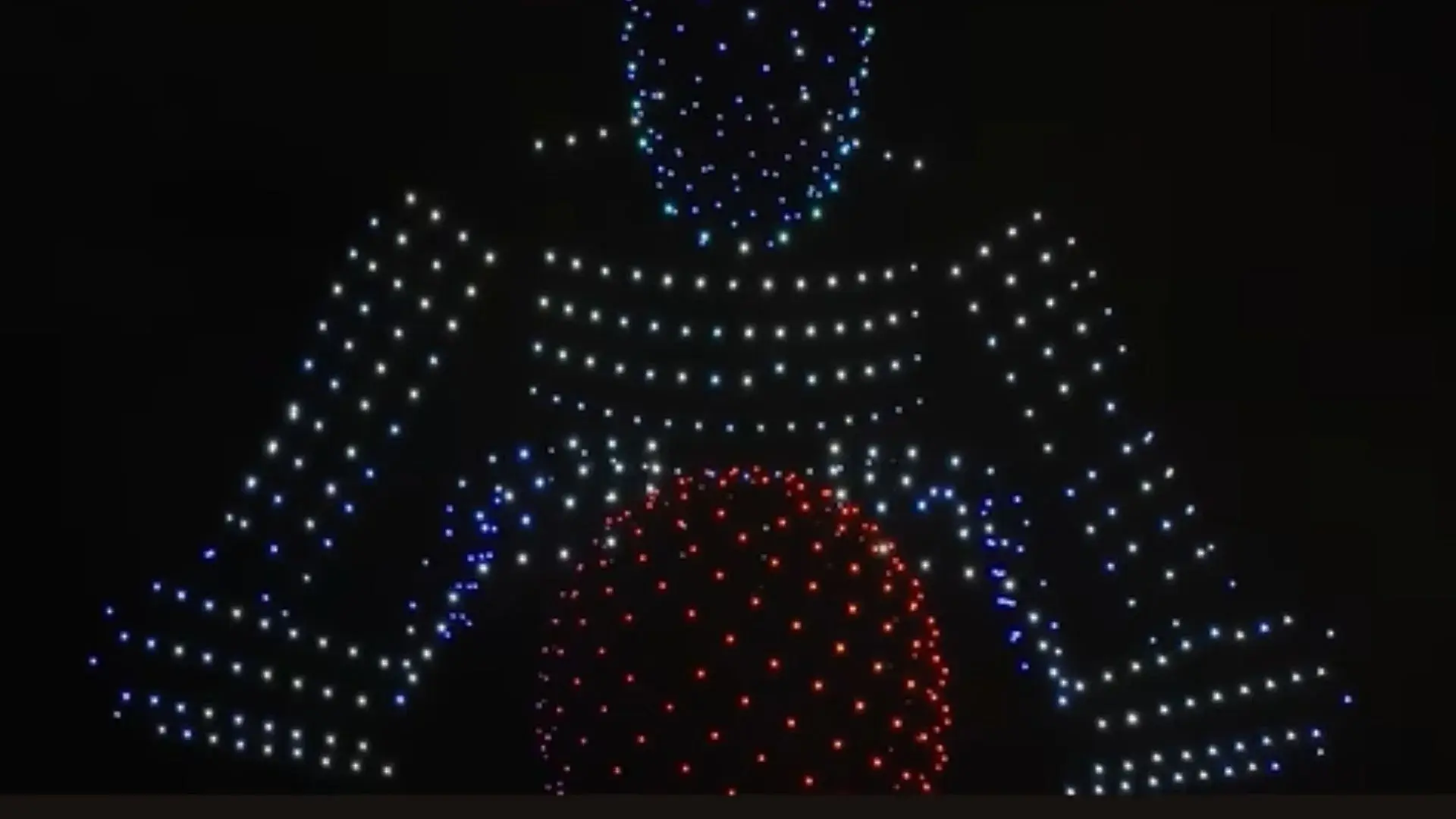 An image from an NLDS drone show depicting the drones taking the form of Tesla's Optimus.